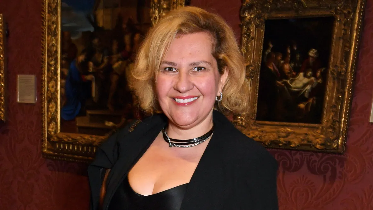 Teni Melidonian smiling during an event, possibly for the Academy.