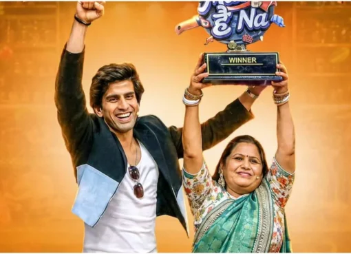 Gullu Tanwar and his mother Munesh Tanwar smiling, holding a trophy after winning 'Maa Hai Na'.