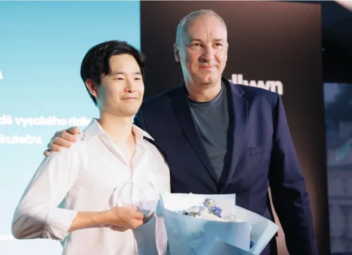 Swiss-Korean director Hae-Sup Sin smiling at the Karlovy Vary Film Festival.
