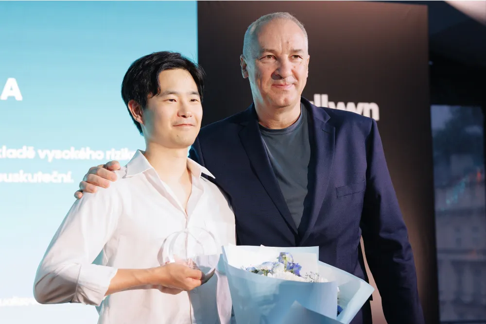 Swiss-Korean director Hae-Sup Sin smiling at the Karlovy Vary Film Festival.