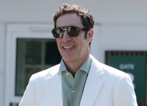 Sacha Baron Cohen dressed as Ali G in a bright yellow tracksuit at Wimbledon.