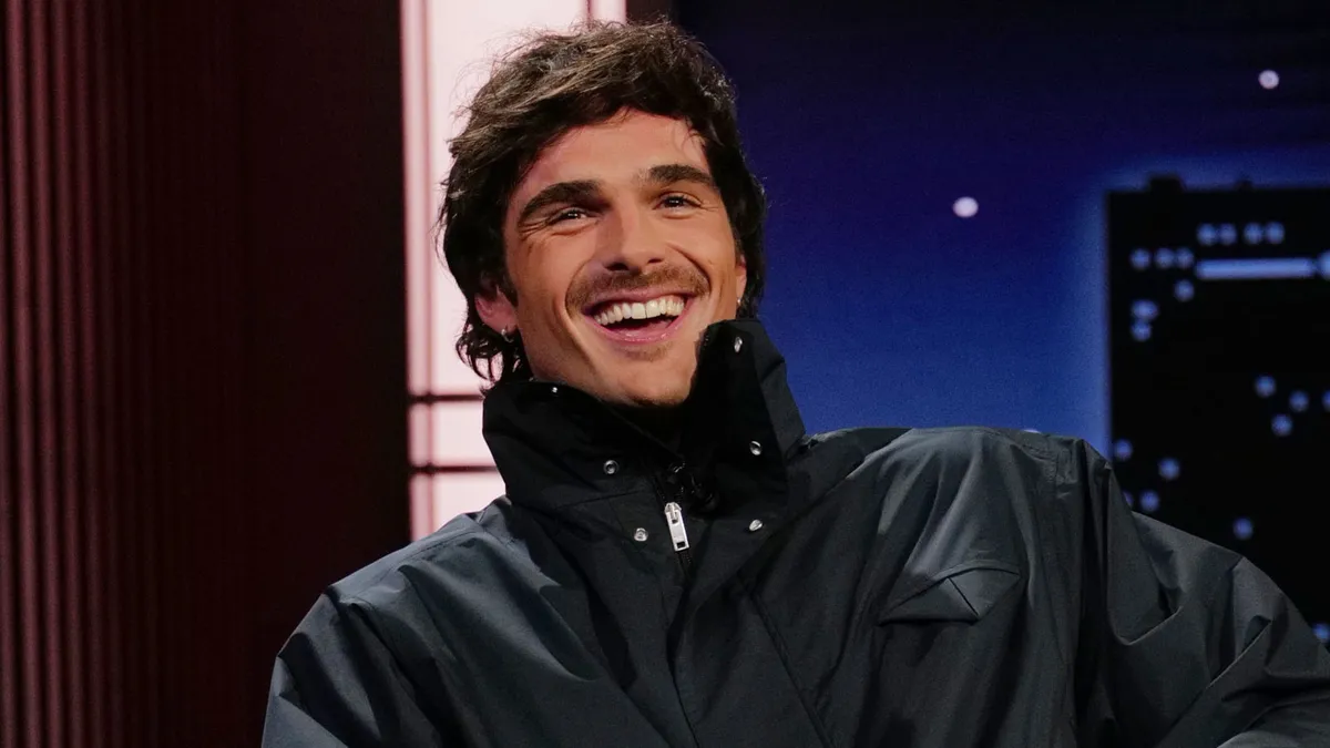 Jacob Elordi looking thoughtful on a talk show.