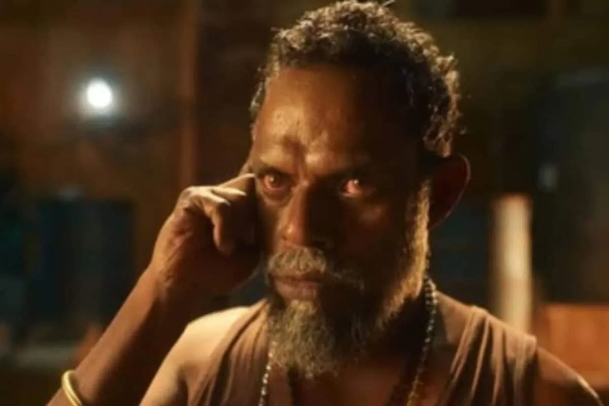 A close-up of actor Vinayakan looking serious