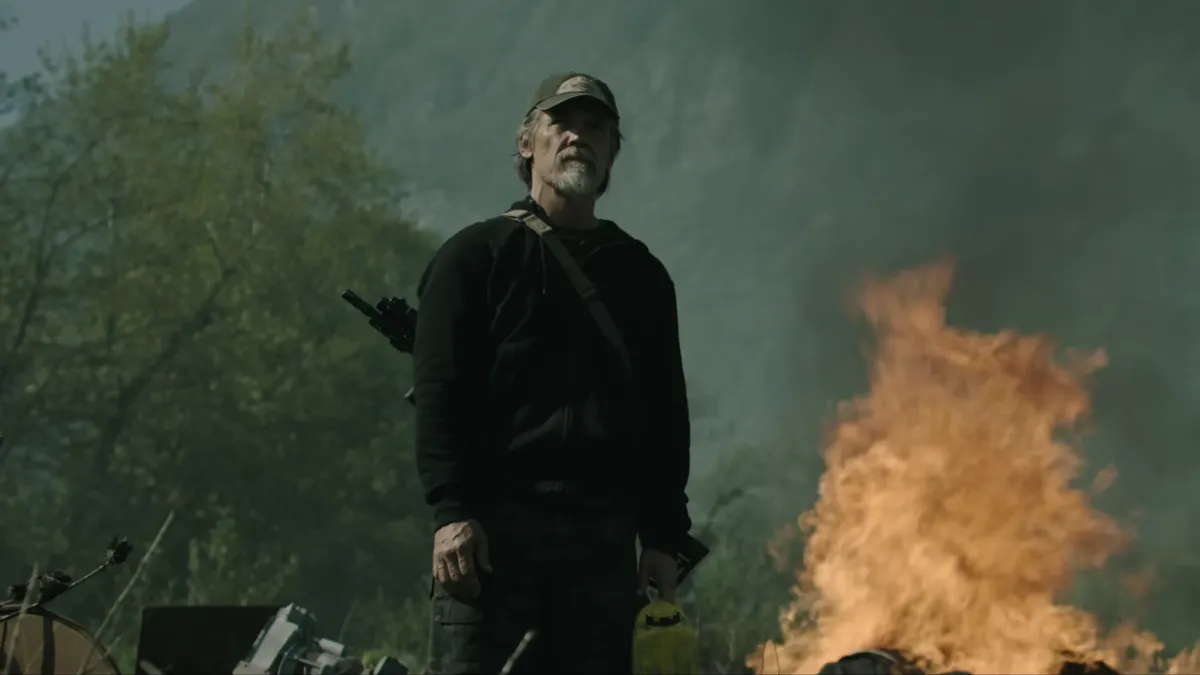 Josh Brolin looking intense in a movie scene.