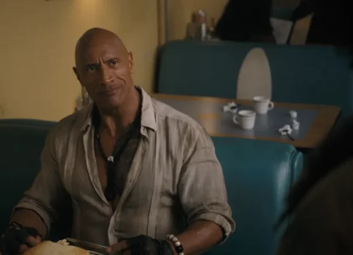 The videogame characters from Jumanji standing in a regular kitchen.