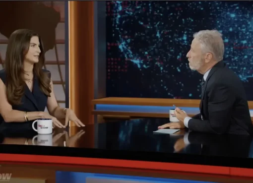 Kaitlan Collins talking on a late night talk show set