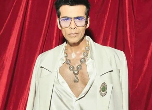 Karan Johar enthusiastically dancing with a towel at Akansha Ranjan Kapoor's pre-wedding sangeet.