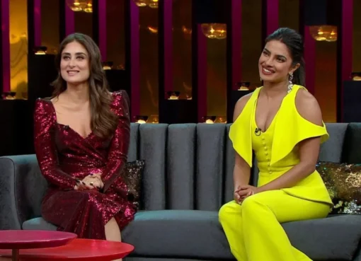 Kareena Kapoor and Priyanka Chopra smiling on the Koffee With Karan set.