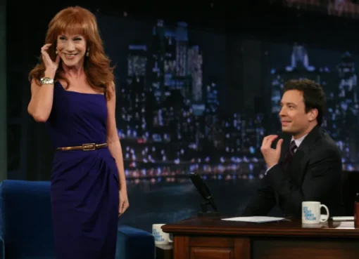 Comedian Kathy Griffin on stage with a microphone.