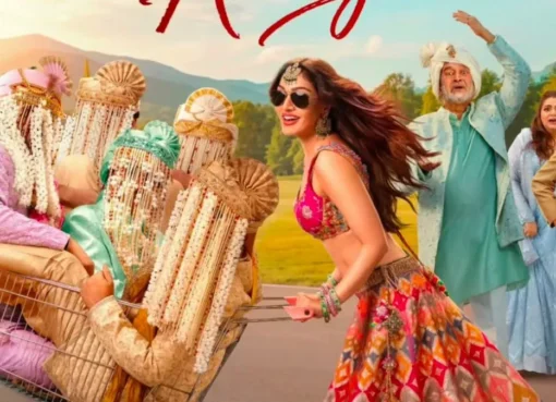 Khushali Kumar smiling, surrounded by enthusiastic moviegoers at a theater.
