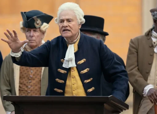 Larry David looking confused next to a person dressed as George Washington