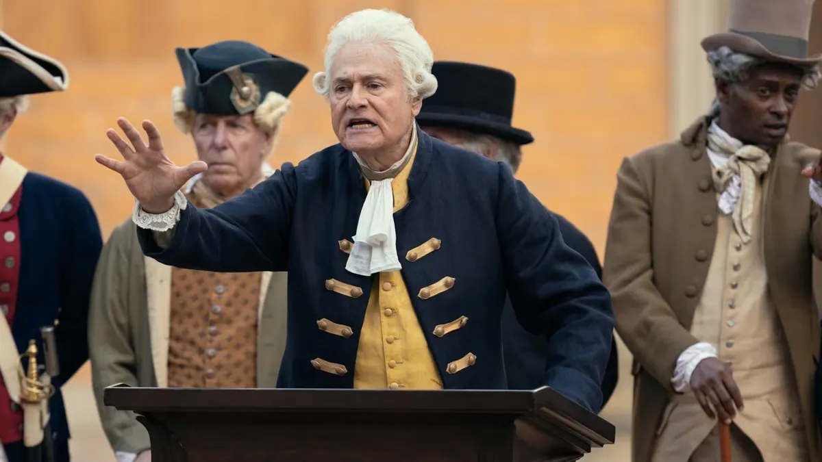 Larry David looking confused next to a person dressed as George Washington