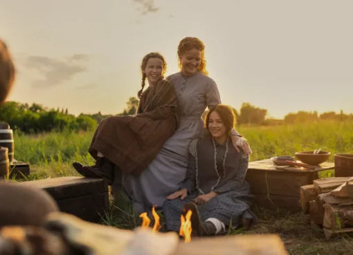 A screenshot from 'Little House on the Prairie' showing a family outdoors.