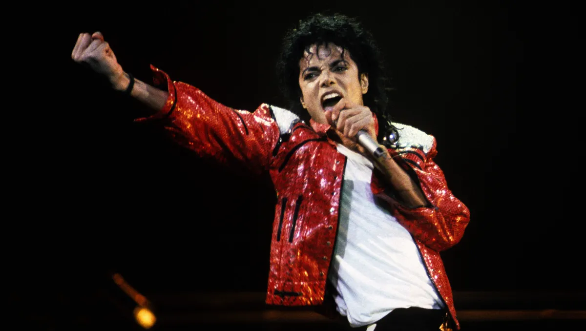 Michael Jackson mid-performance, looking dynamic with a classic pop star aesthetic.