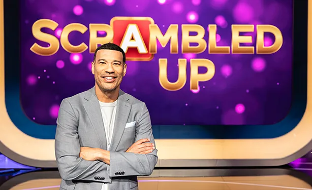 A bright and colorful game show set with word puzzles