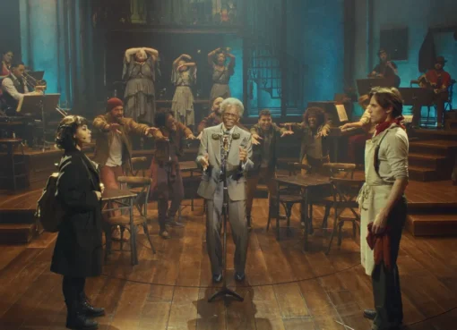 A stage scene from Hadestown with musicians and dancers, lit with warm, earthy tones, capturing a jamboree vibe.