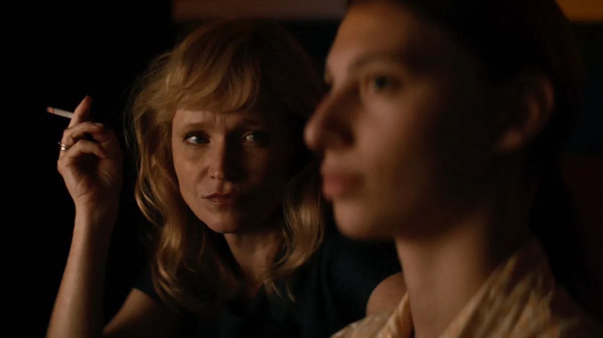 Film still showing 1980s Czechoslovakian fashion and interiors, with a muted color palette.