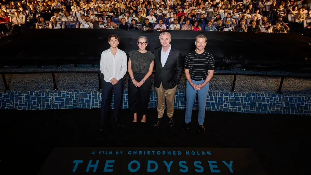 Director Christopher Nolan speaking at an event.