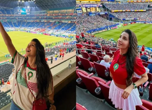 Nora Fatehi smiling at a football event with a microphone in front of a stadium crowd.