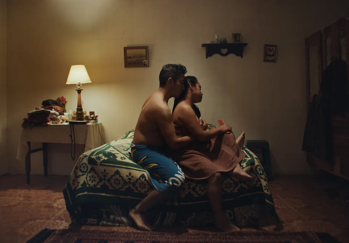 A captivating still from the Guatemalan drama 'Nosotros', hinting at its raw and honest visual style.
