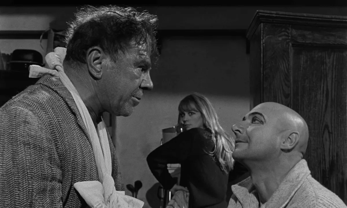 A vintage film projector casting light onto a screen, with iconic directors' names like Polanski and Buñuel subtly visible.