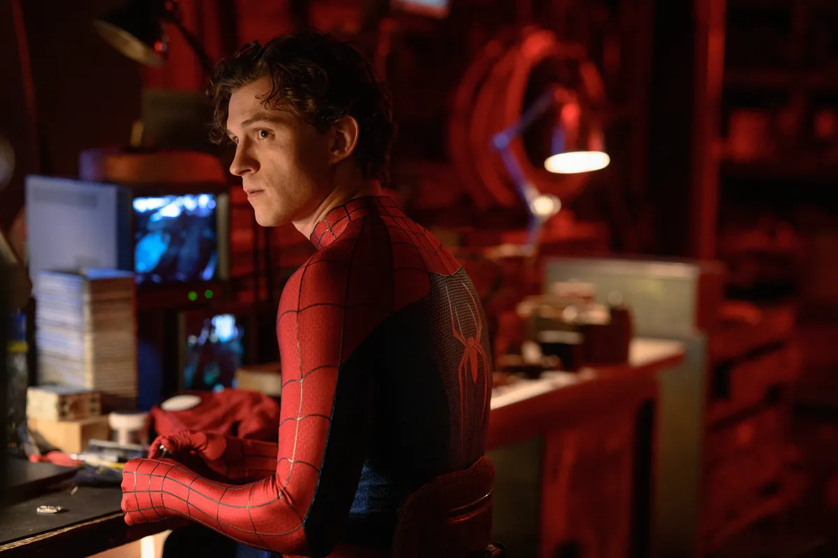 Spider-Man swinging through a starry, cosmic background.