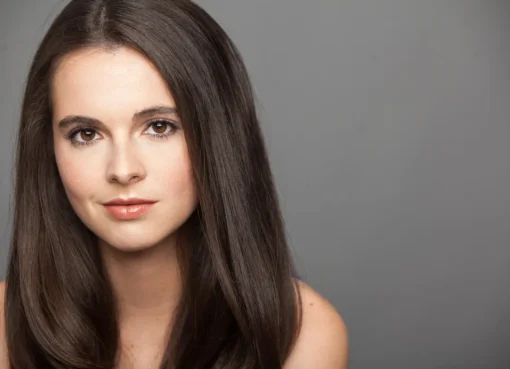 Close-up photo of actress Vanessa Marano smiling warmly.