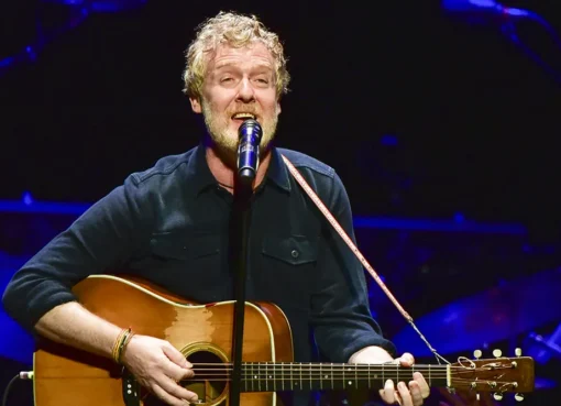 Glen Hansard, the musician and actor, performing with his acoustic guitar.