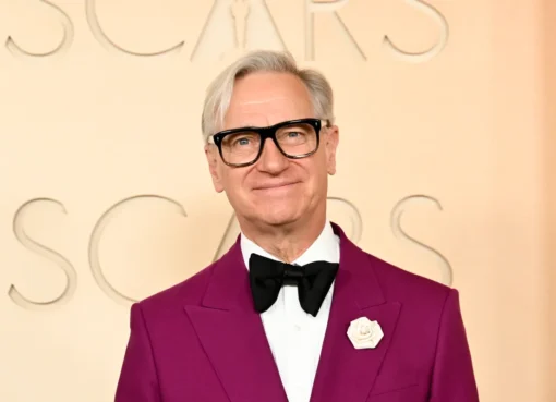 Paul Feig looking thoughtful, with a shadowy, suspenseful background suggesting a high school hallway.