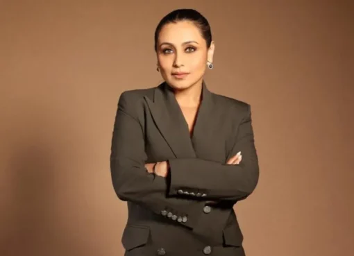 Rani Mukerji smiling elegantly at an event.