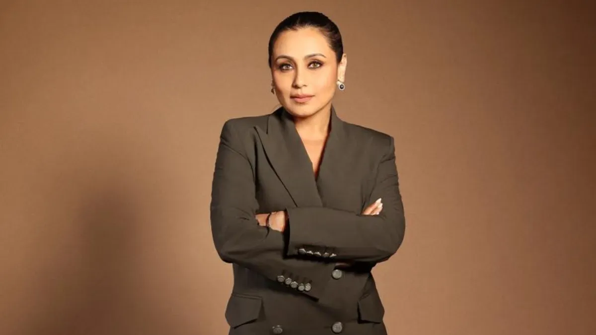 Rani Mukerji smiling elegantly at an event.