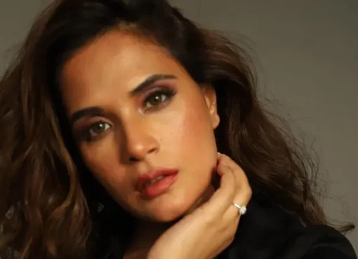 Richa Chadha smiling thoughtfully, possibly for a promotional photo.