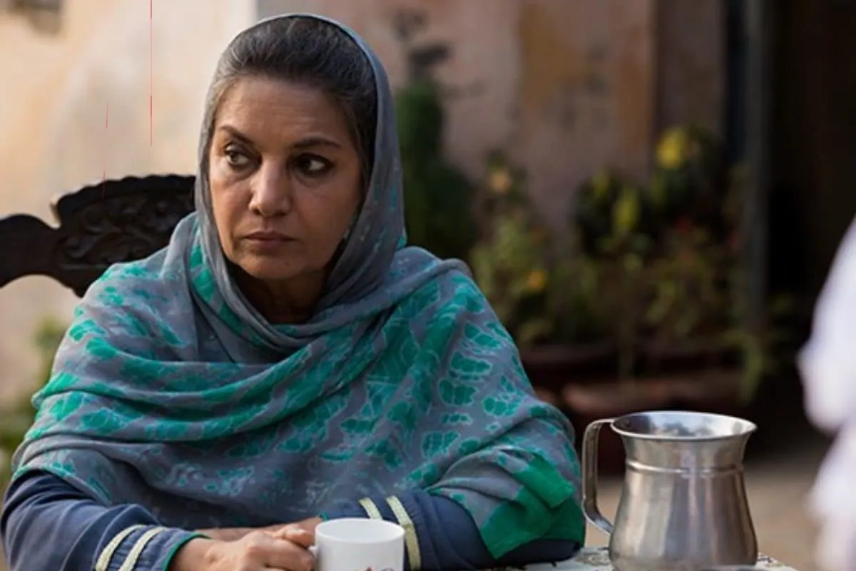 Shabana Azmi speaking at a public event with a serious expression