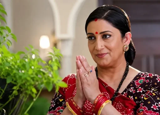 Smriti Irani smiling in a traditional Indian outfit during an interview