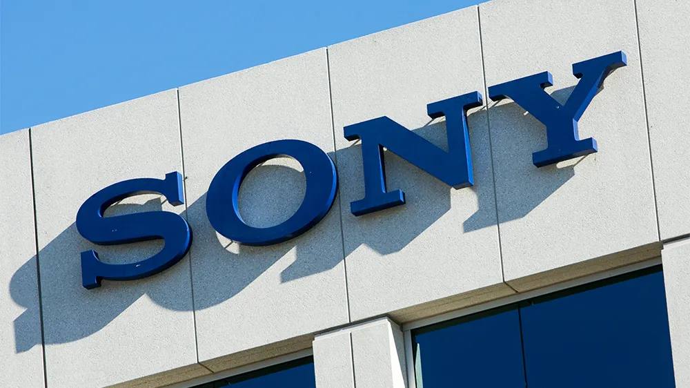 A split image showing a film reel looking down and musical notes soaring up, representing Sony's mixed quarter results.