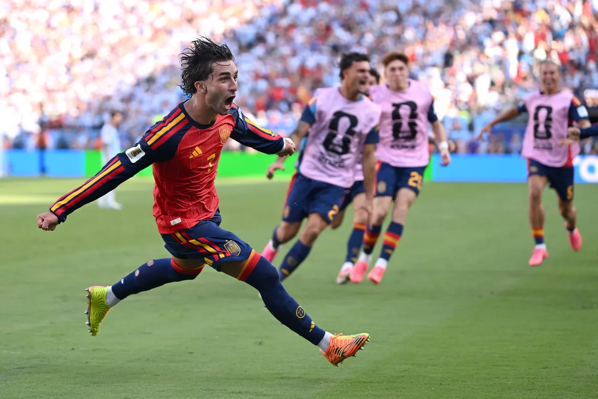 Soccer players celebrating a goal during the World Cup Final.