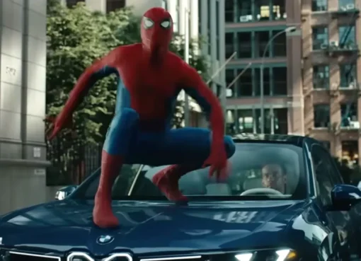 Spider-Man swinging through a city.
