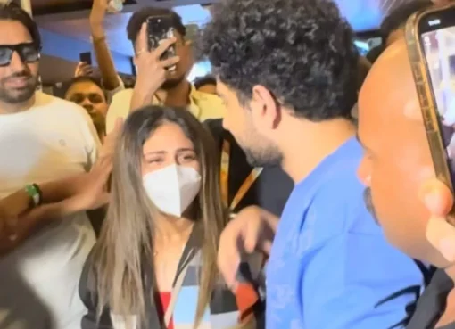 Samay Raina holding hands with a woman in public.