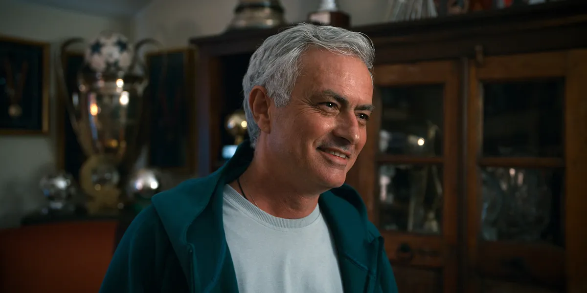 Jose Mourinho smiling amidst his personal trophy collection in the Netflix documentary teaser.