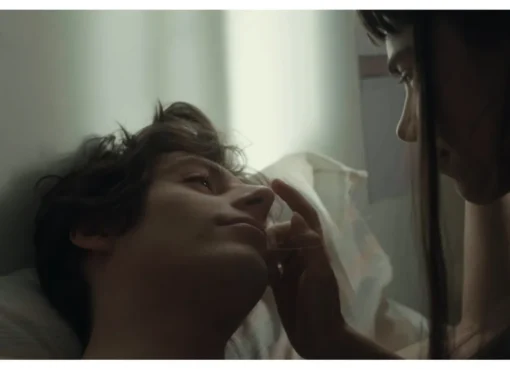 A still from the movie 'Lover, Not a Fighter' showing a young man looking relaxed.