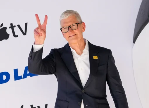 Tim Cook, CEO of Apple, smiling during a presentation about Apple products.