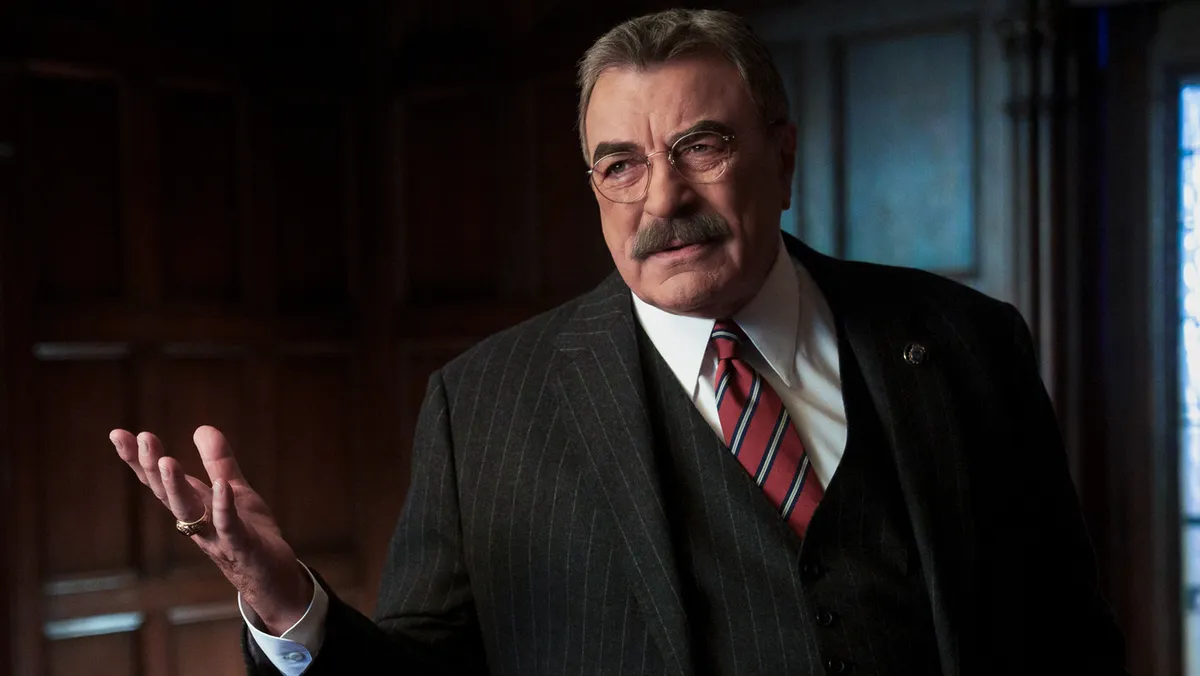Tom Selleck in character as Frank Reagan from Blue Bloods, looking thoughtful.