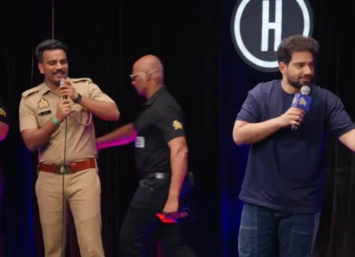 UP Police constable Kapil Dinkar smiling with a winner's cheque on the India's Got Latent set.