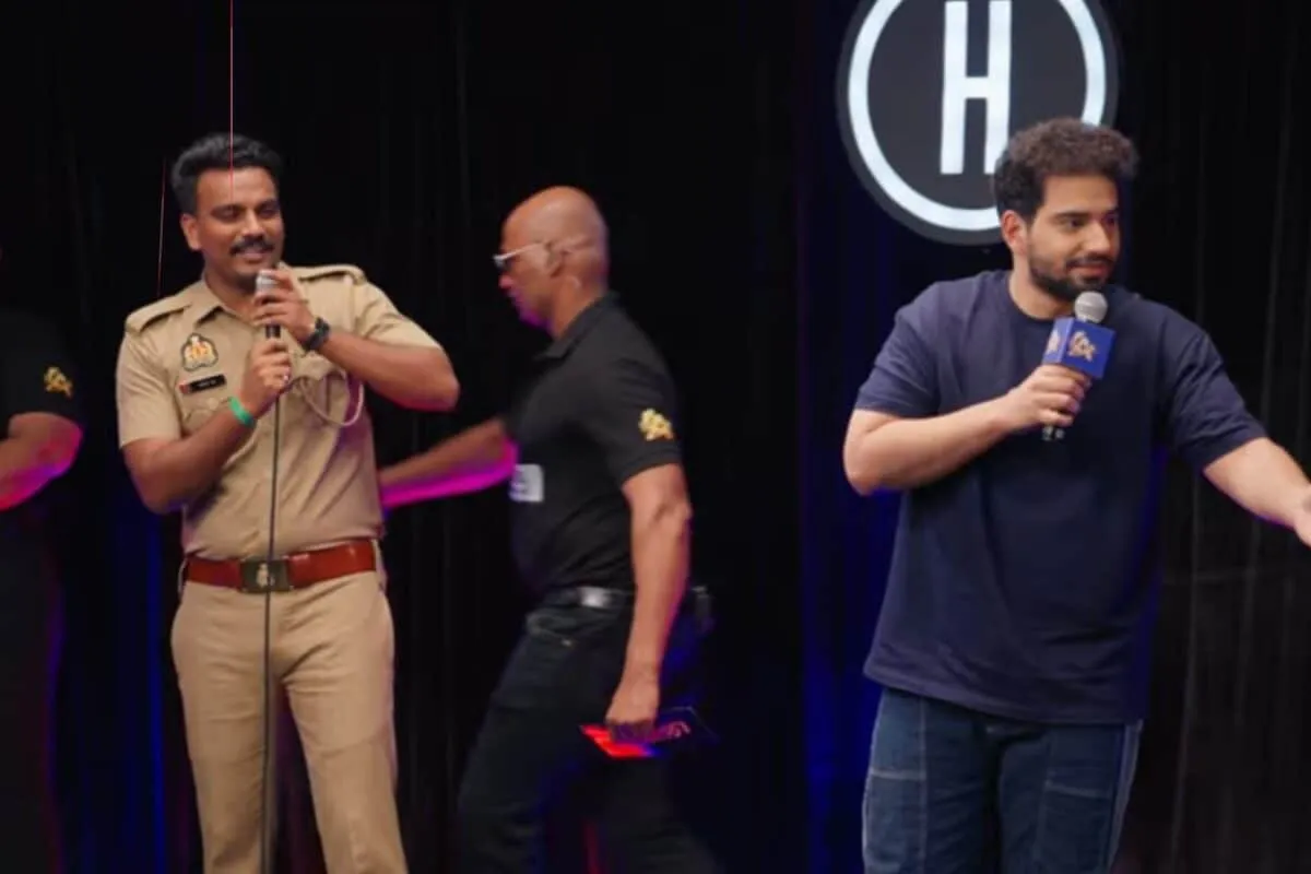 UP Police constable Kapil Dinkar smiling with a winner's cheque on the India's Got Latent set.