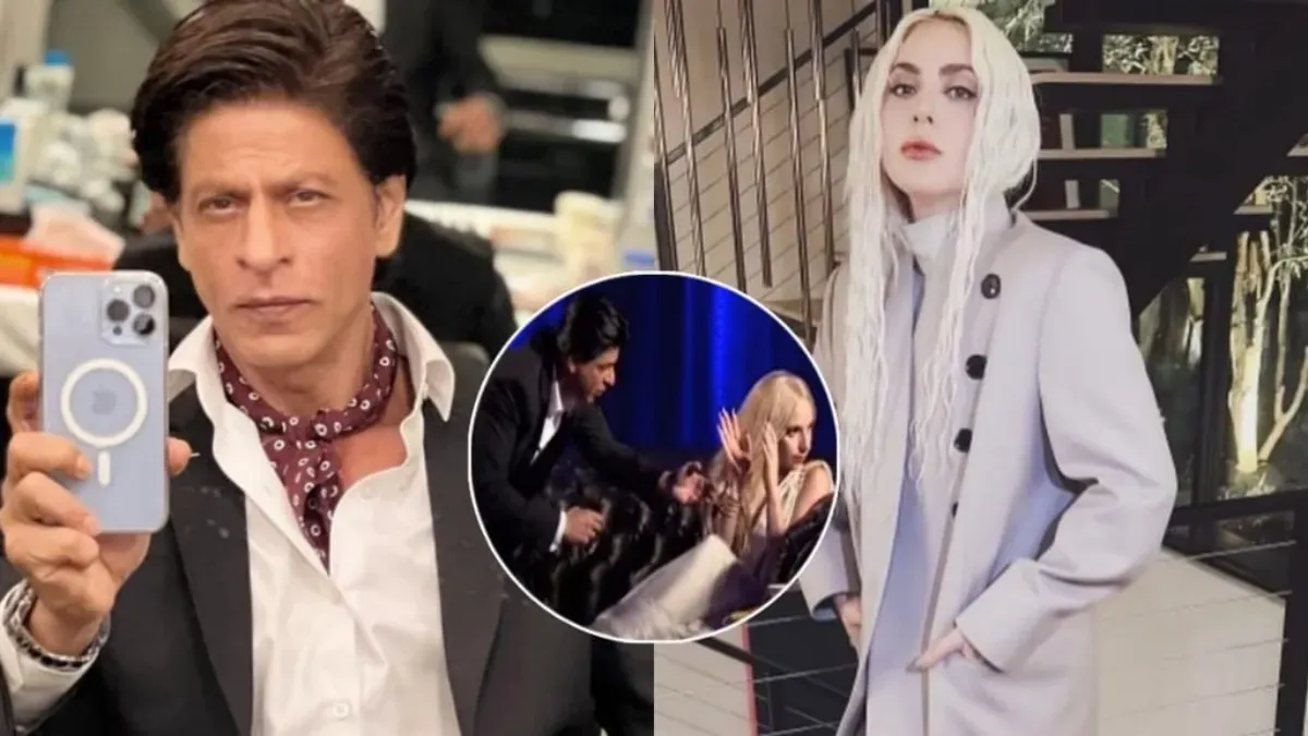 Shah Rukh Khan on stage offering a watch to Lady Gaga.