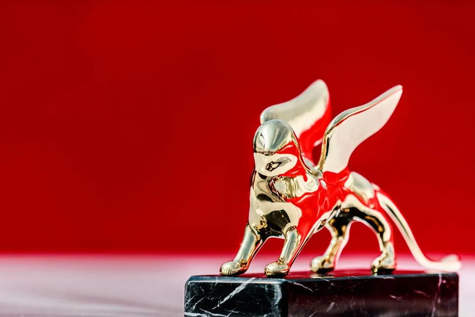A photo of the Venice Film Festival logo with a red cross over it.