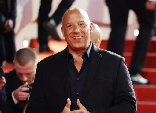 Vin Diesel on the set of 'Fast Forever,' looking serious and focused.