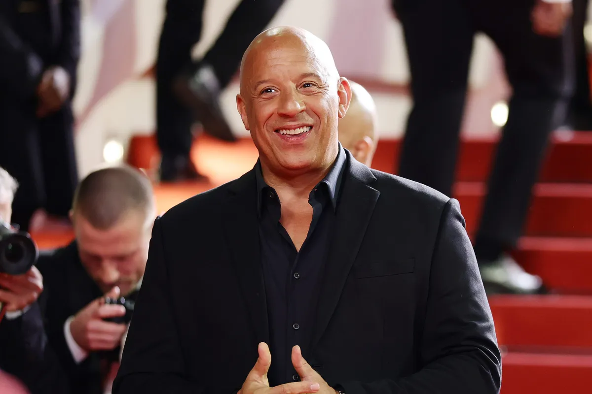 Vin Diesel on the set of 'Fast Forever,' looking serious and focused.