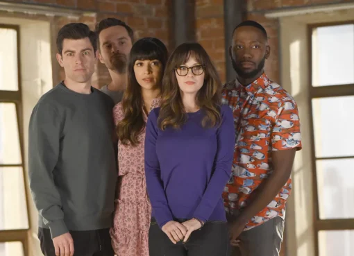 The cast of New Girl smiling together.