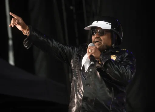 Victor Willis performing with the Village People, dressed as a police officer in his iconic costume.